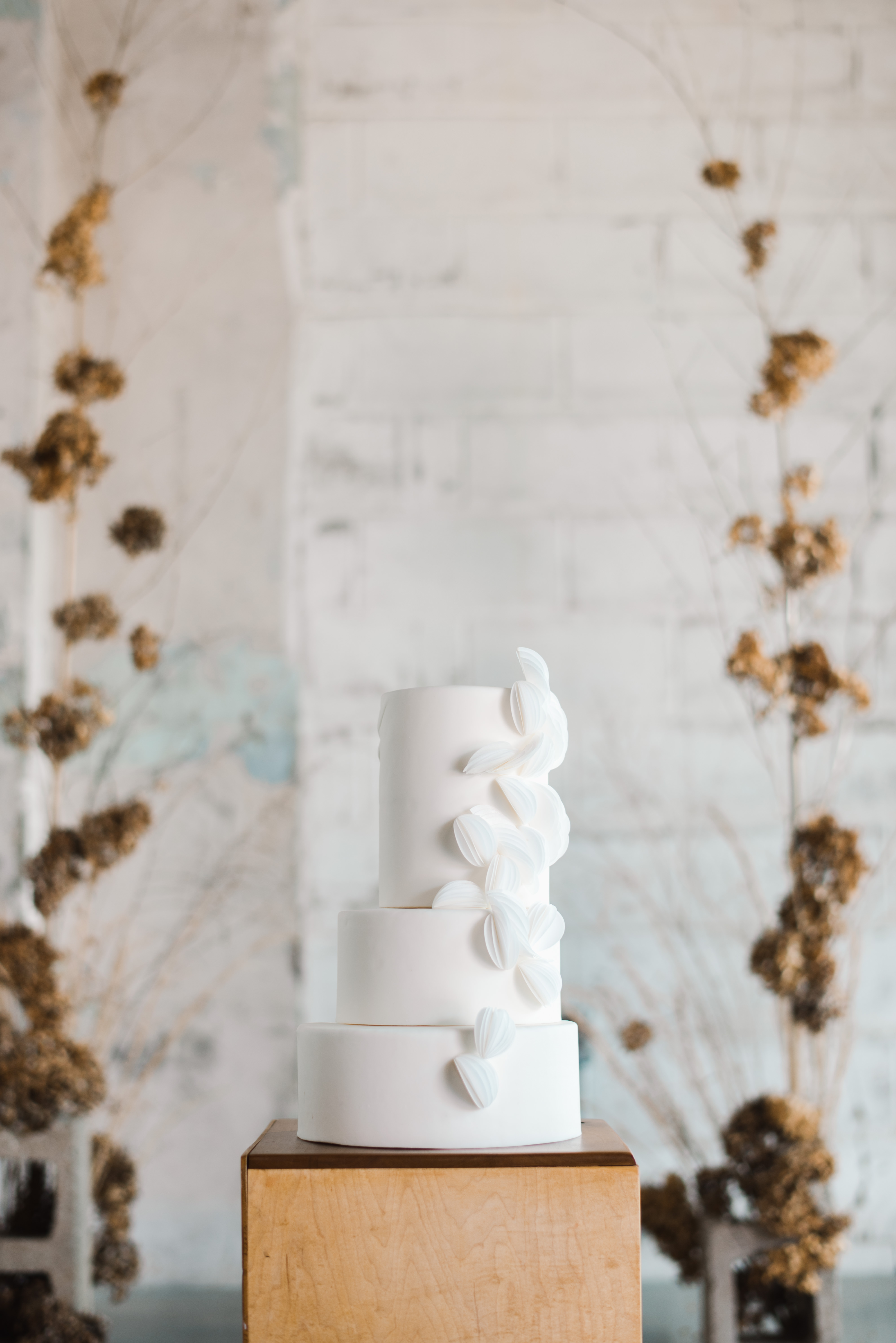 Delicate white wedding cake with rice paper
