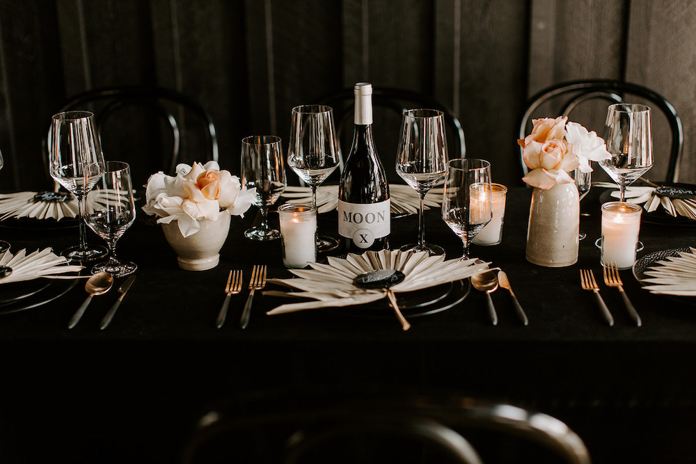 Moody black wedding table designed by Northwest Arkansas wedding planner