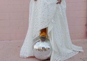 Bride in Halseene dress in Fayetteville AR with disco ball