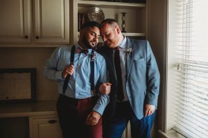 Gay wedding couple in Northwest Arkansas wearing navy and maroon