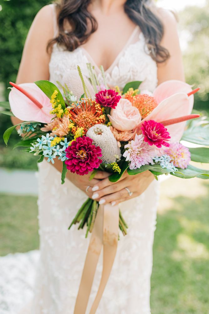 bridal bouquet with monstera, anthurium, dahlia, rose, zinnia
