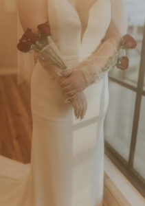Rose flowers in long gloves wedding photo